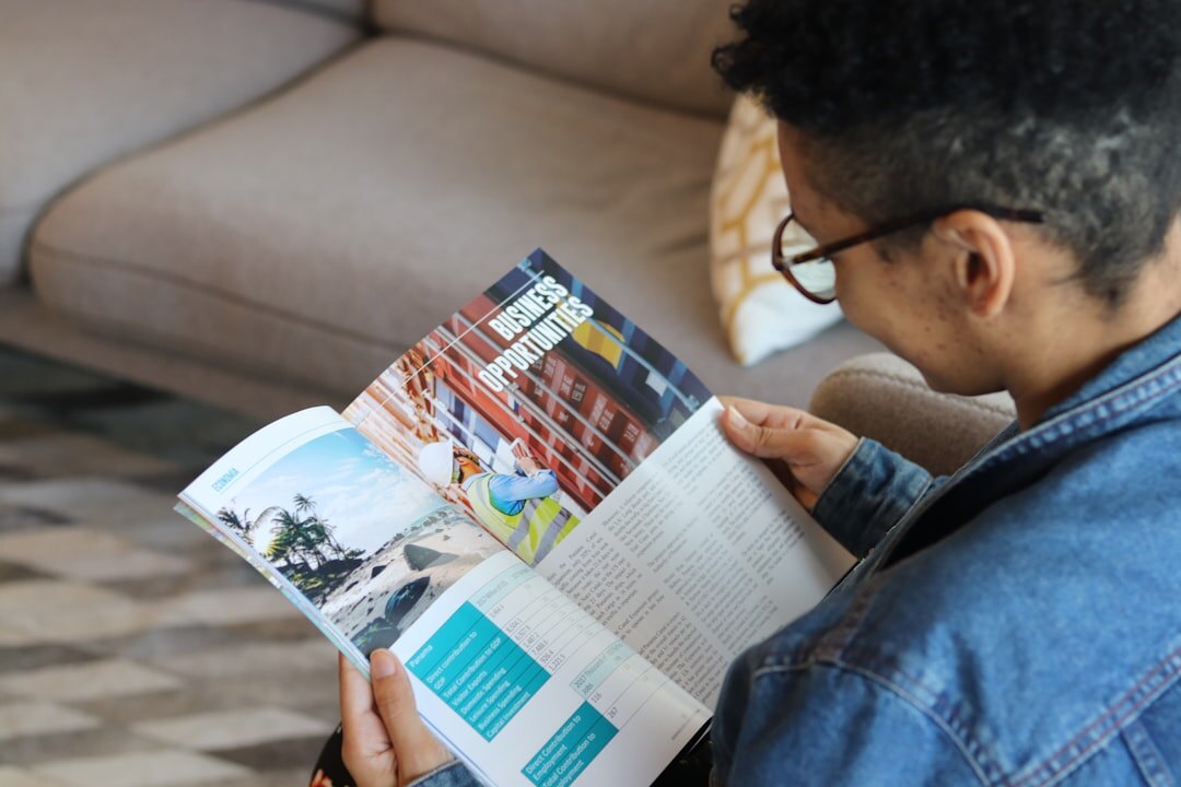 Man reading a printed market trends report